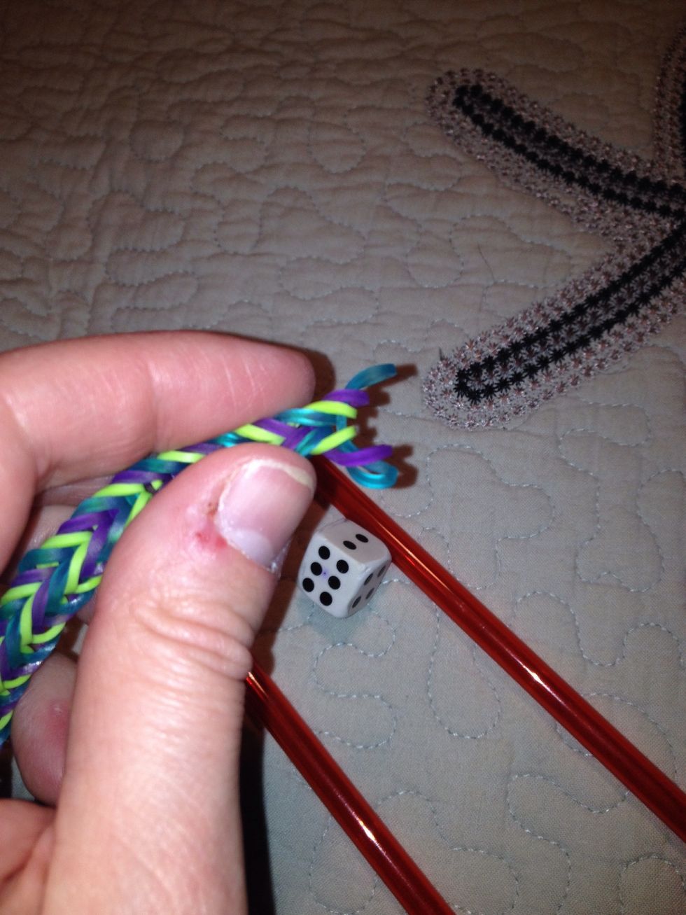 Loop through to secure all elastic ends. This also ensures you end with a single elastic to clip into s clip.
