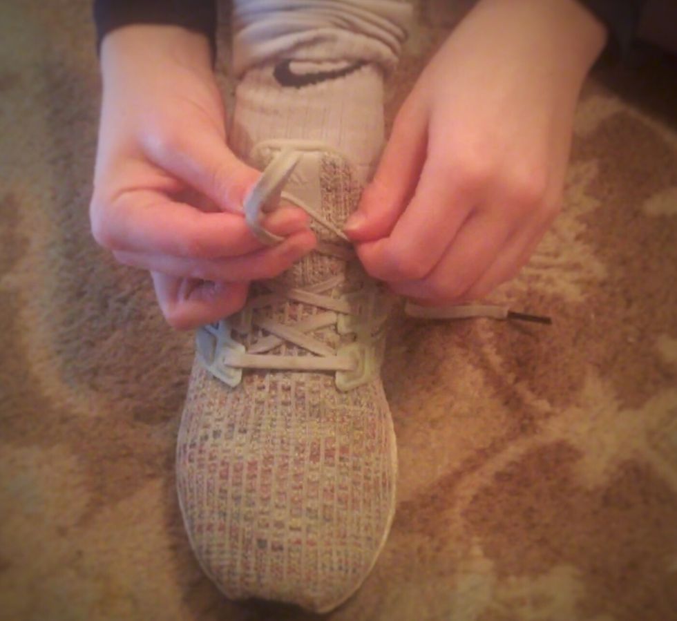 Loop your other lace around your \u201cbunny ear\u201d.