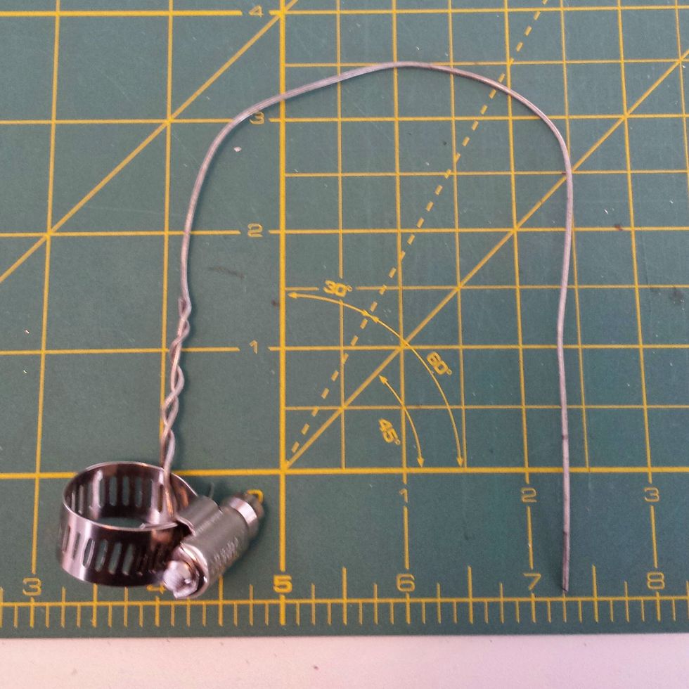 Loop your wire around the clamp and twist together approximately 1 1/2 inches.