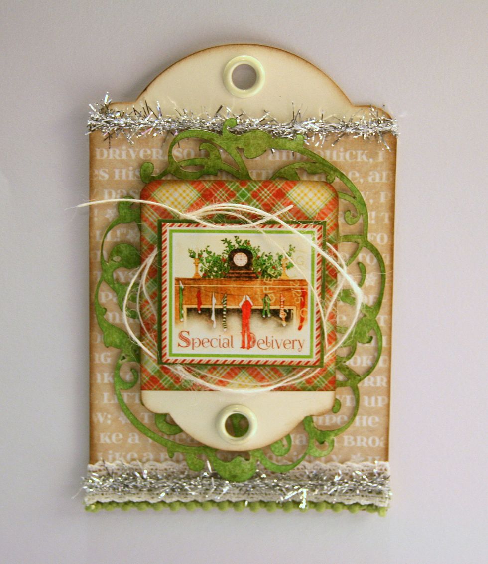 Loosely attach ivory twine with some layers under and over the image.