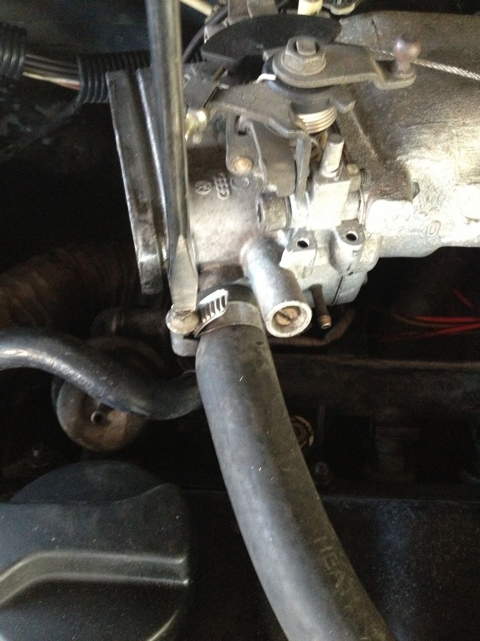 Loosen clamp on hose connecting head cover and intake manifold