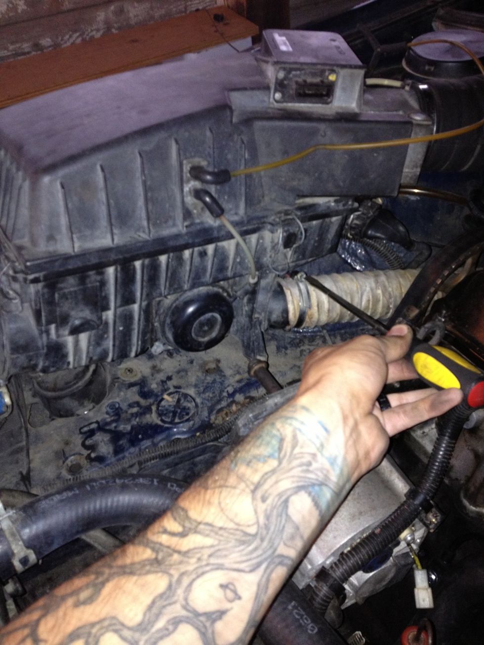 Loosen clamp on lower exhaust hose