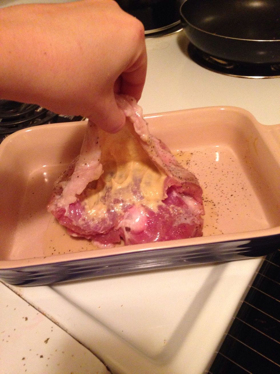 Loosen skin gently with a knife and spread Dijon mustard under the skin