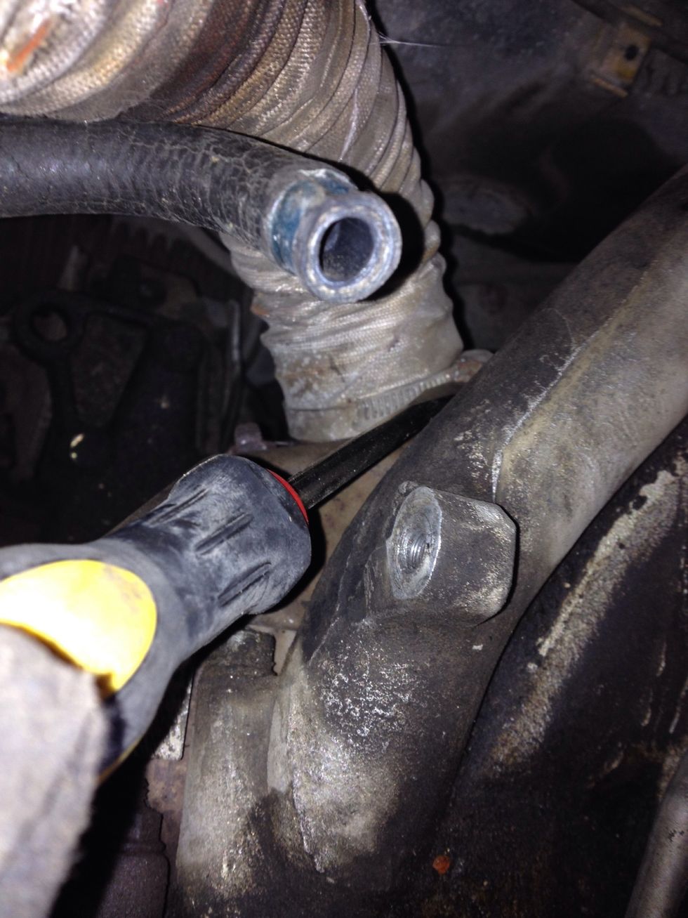 Loosen the clamp from the exhaust manifold... And remove the hose!