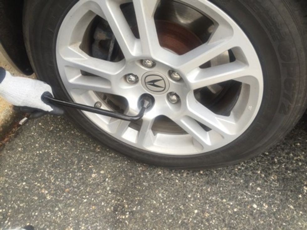 Loosen the lug nuts just enough that they are not longer extremely tight.