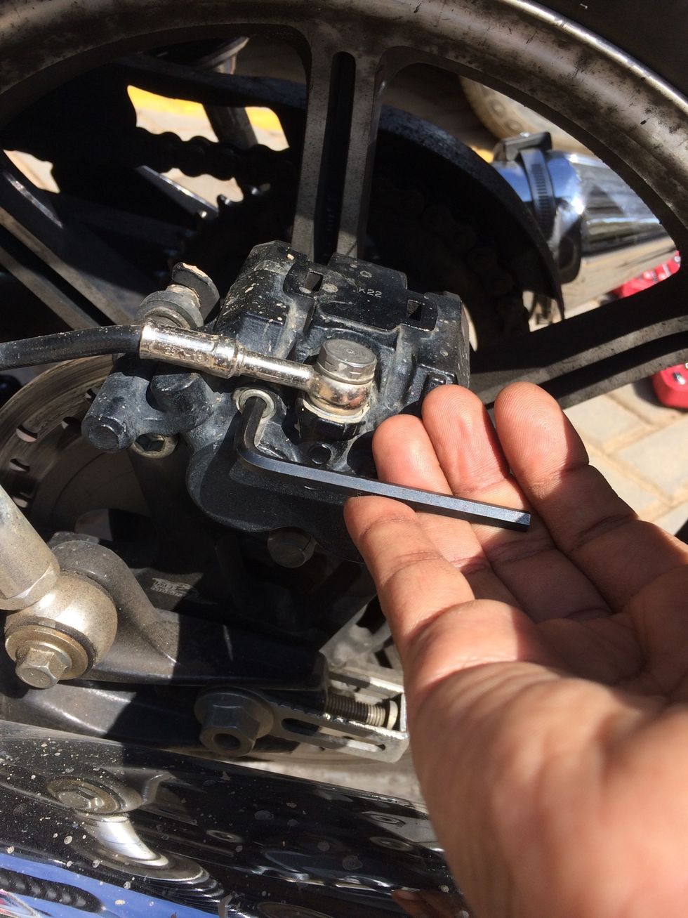 Loosen the pad retaining pins by turning anti clockwise