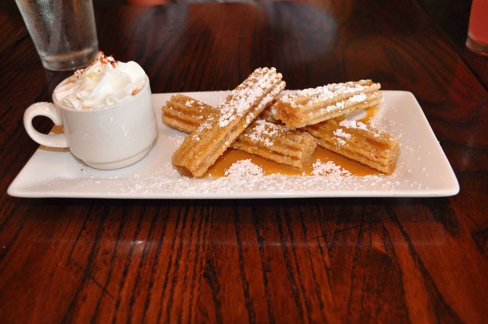 Los churros y chocolate es muy delicioso.