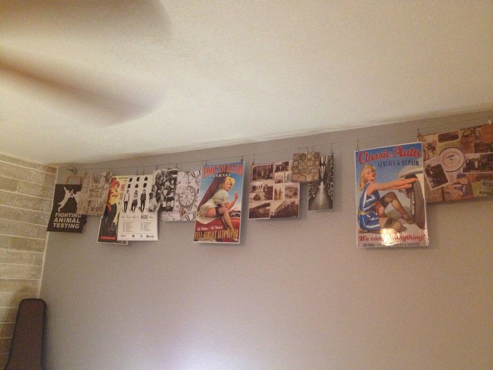 Love scrapbook pages, unique bags, concert posters and random crap like me? You hoarder! Show off your collection with some wire and clips. Could use clothes line clips for some added flare.