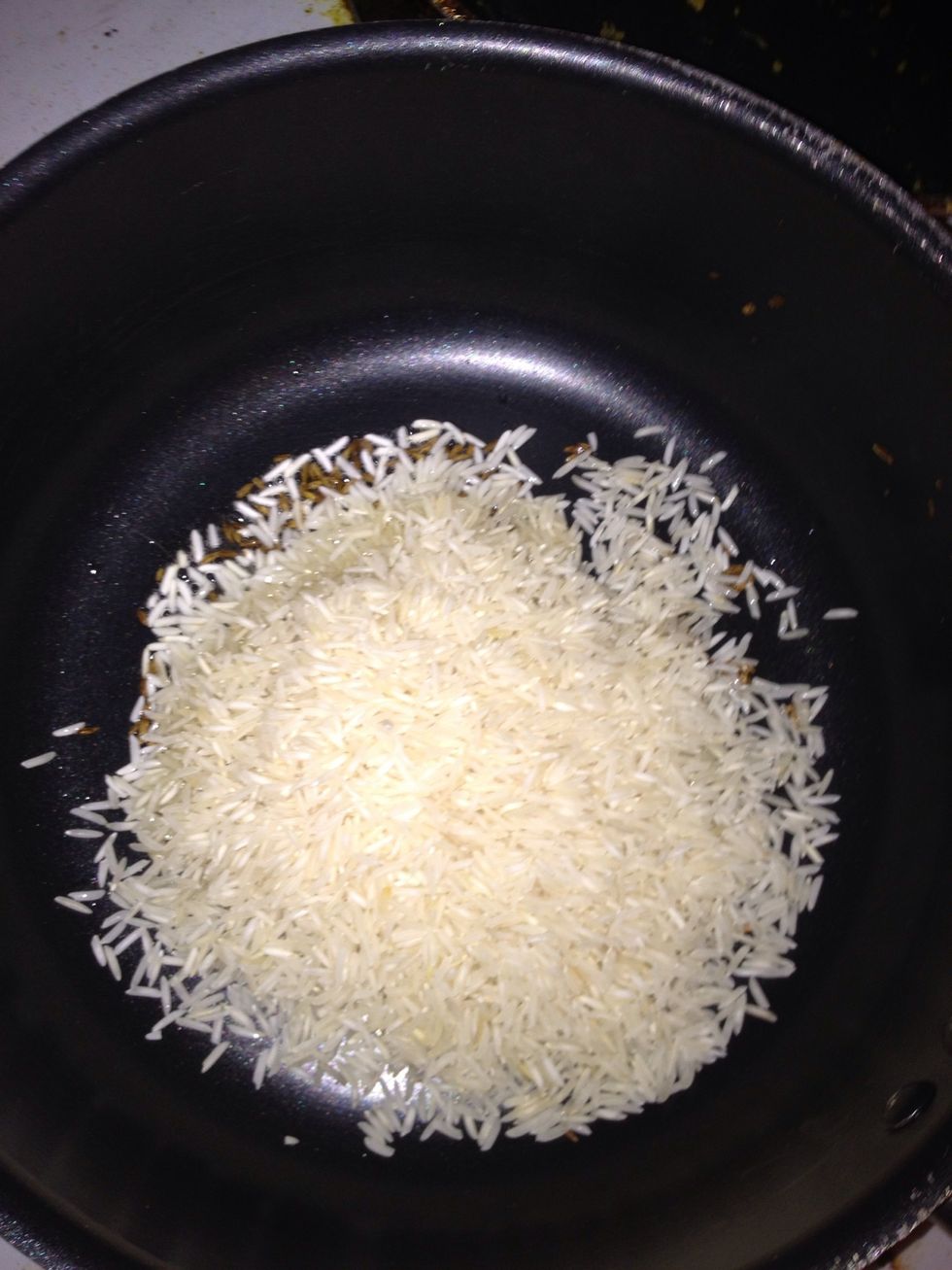 Lower heat to medium and add the rice.