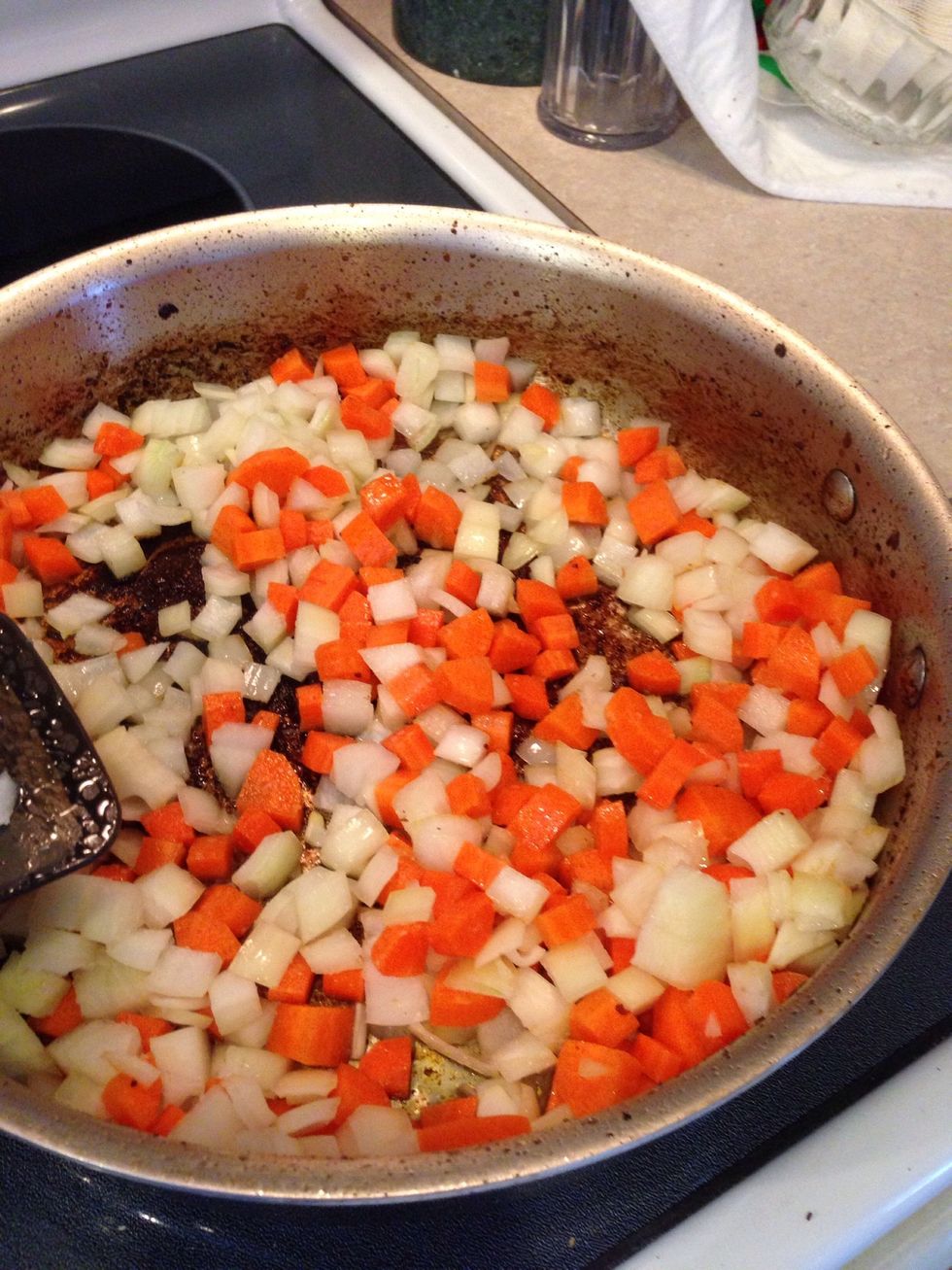 Lower heat to medium and heat 2 teaspoons of oil in the now empty skillet. Add the onions, carrots and a 1/4 teaspoon of salt. Cook until the vegetables are softened, about 5 minutes.