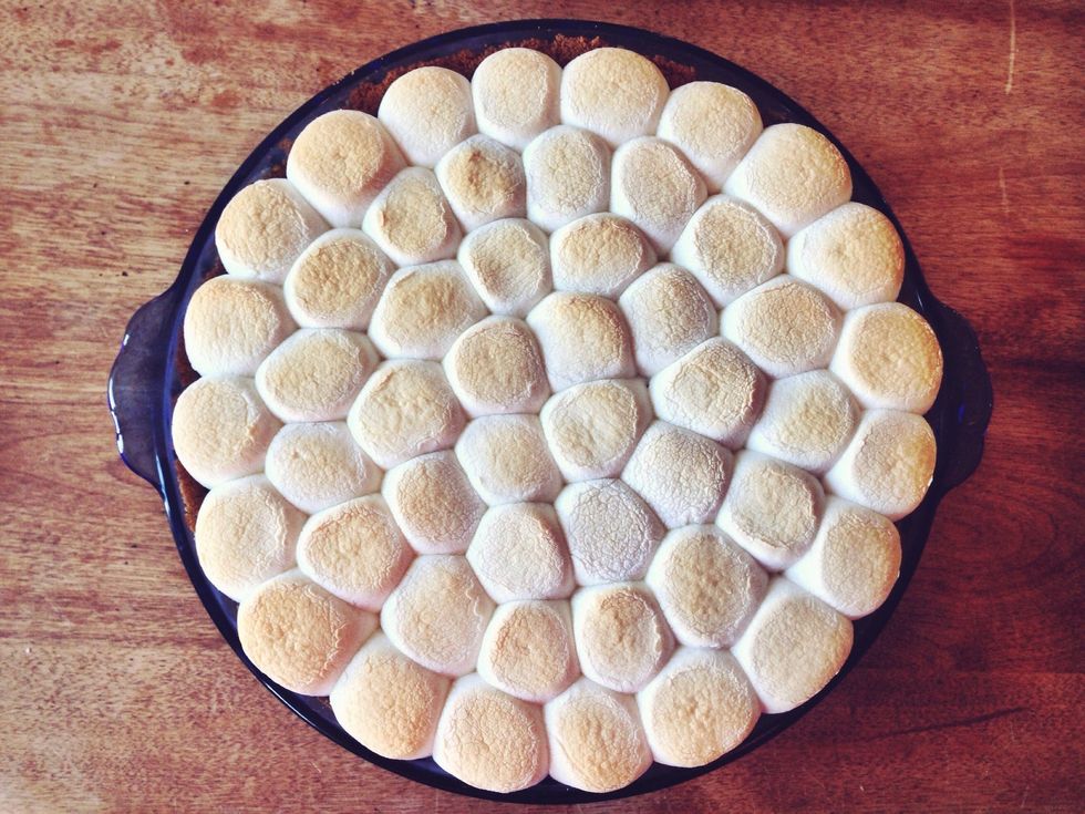 Lower oven rack to the middle position, and set oven to the lowest broil setting. Place pie on the rack and lightly toast the top. You can also use a kitchen torch to toast the marshmallows instead.