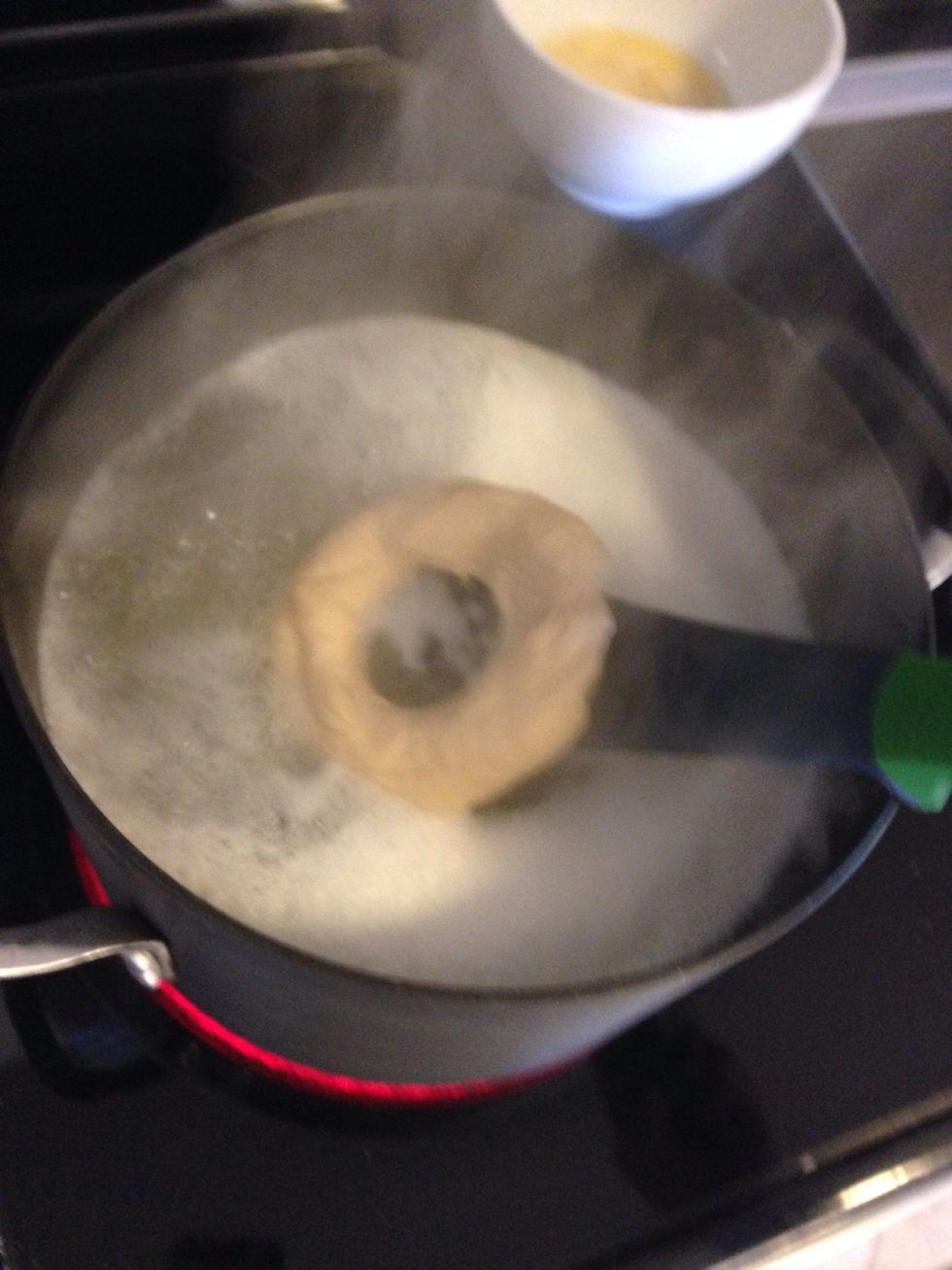 Lower the bagels into the water with a slotted spoon. Let them boil for 45 sec.