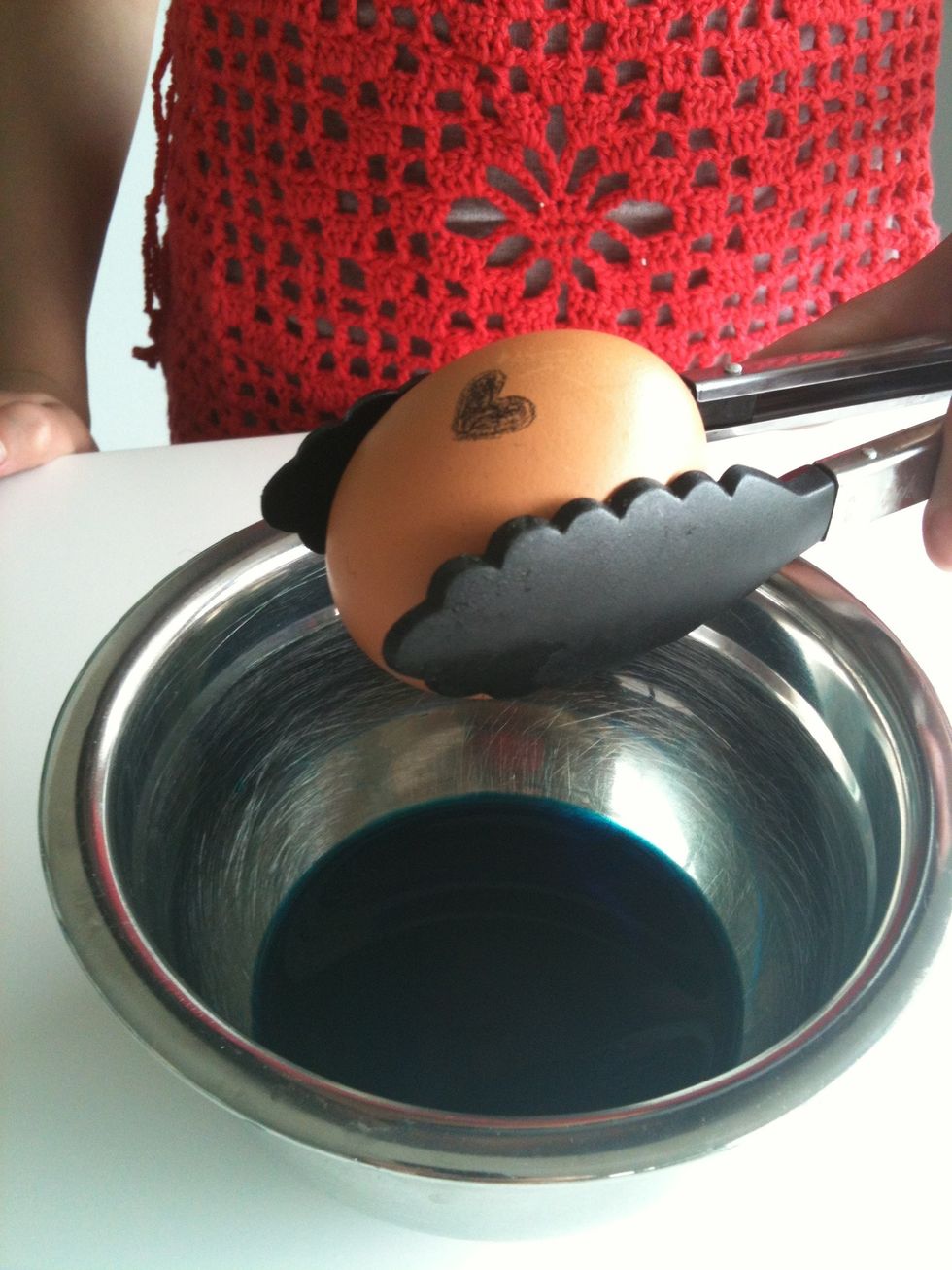 Lower the egg gently into the bowl and mix it around so all the egg is covered.