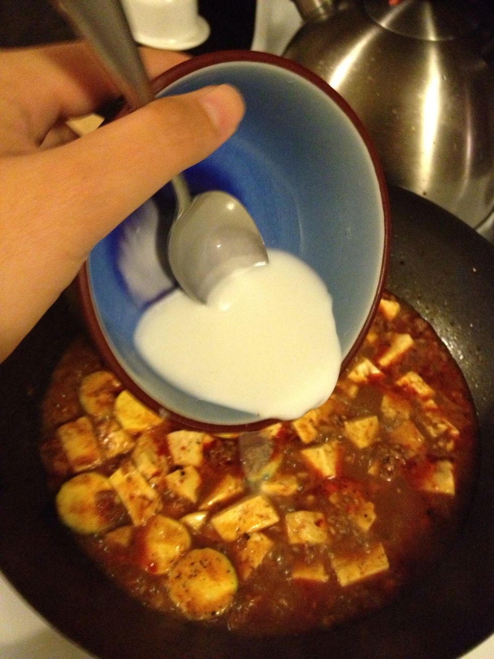 Lower the heat, add the corn starch water.