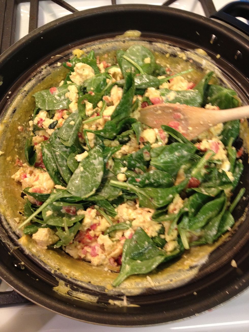 Lower the heat, and let it simmer until the spinach is done.