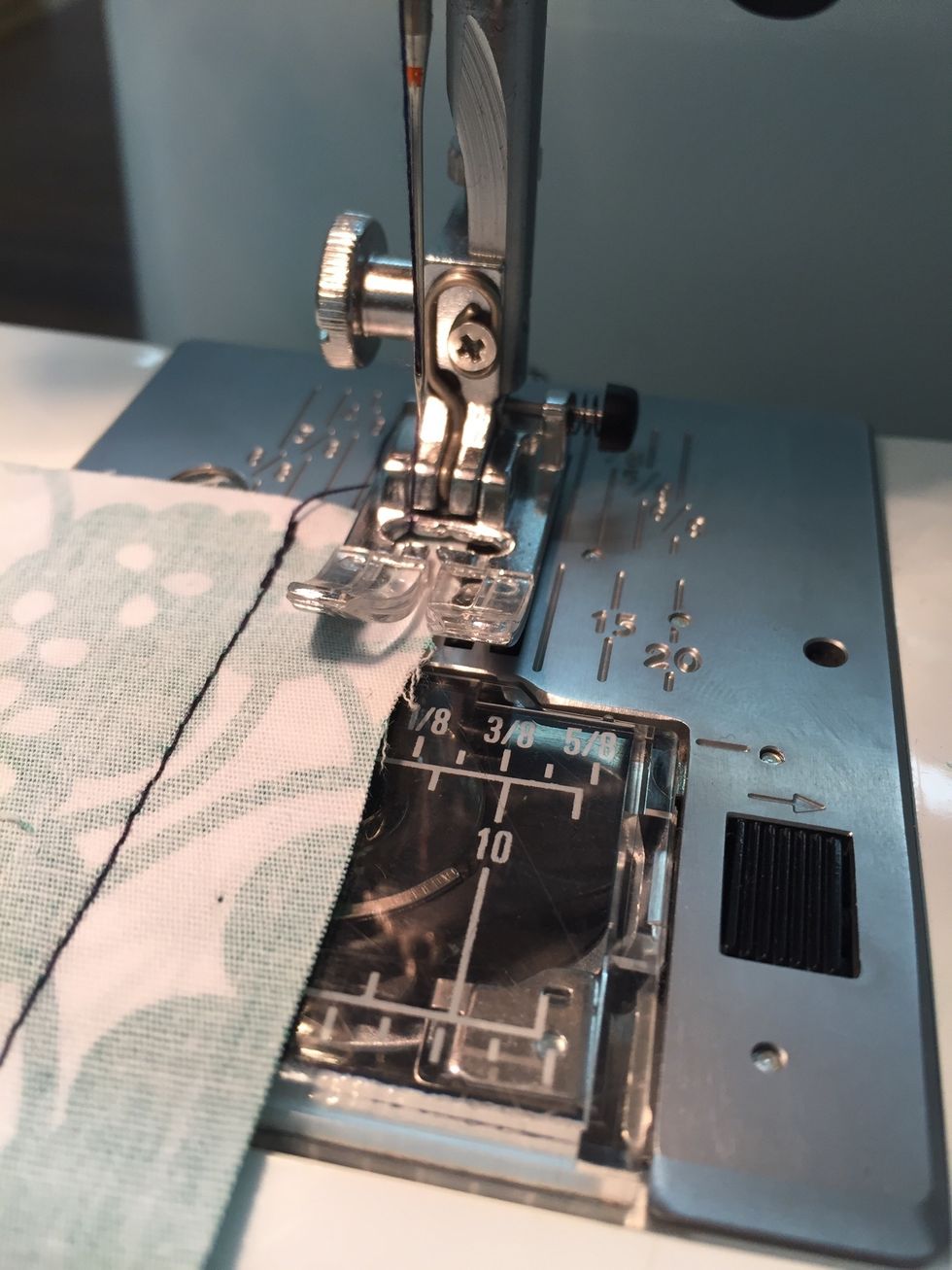 Lower the presser foot so that the EDGE of the fabric is in the CENTRE of the presser foot.