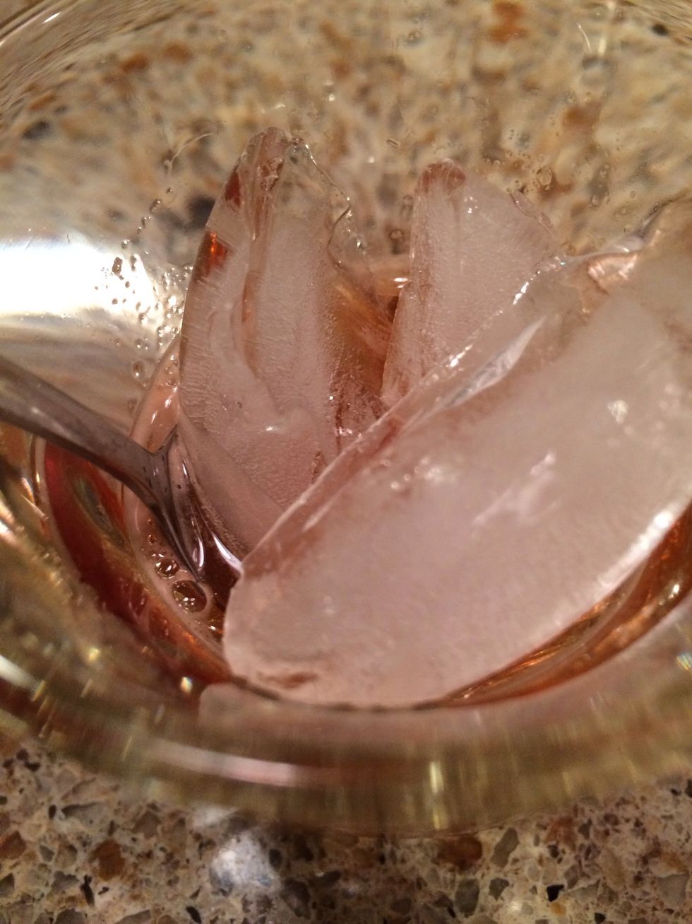 Lower the temperature by adding a few ice cubes. As the ice melts, dilution helps to enhance the flavor by altering the whisky's molecular structure.