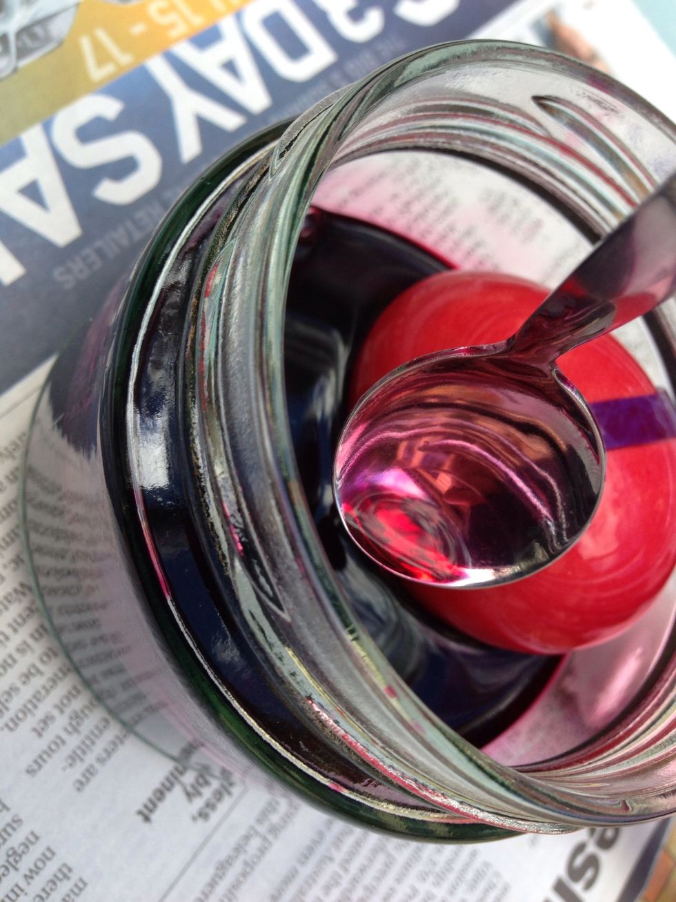 Lower your egg gently into the dye with a spoon and roll it around in the dye gently to cover the egg.