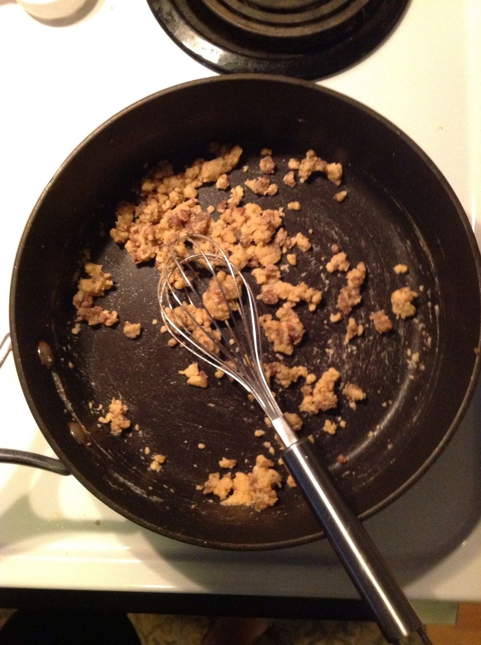 Lower your heat setting & add flour. Whisking grease & flour together the mixture will start to clump up.