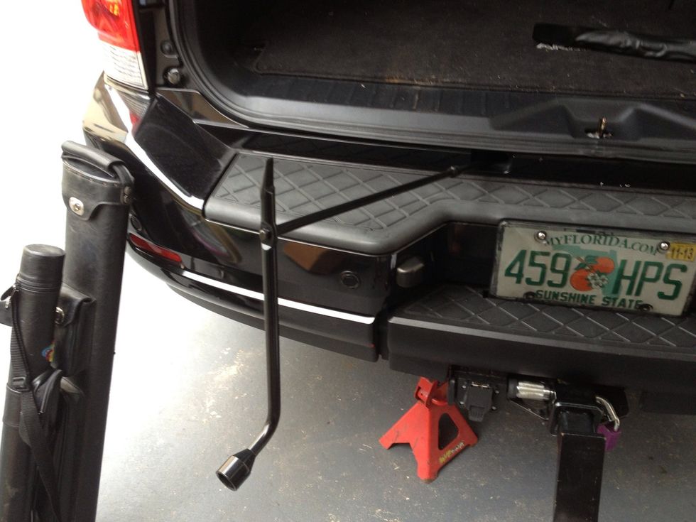 Lowering the chain that holds it up. Since I have to open my trunk to get the access I wasn't worried about locking it, but if yours is open, you may want to chain it up