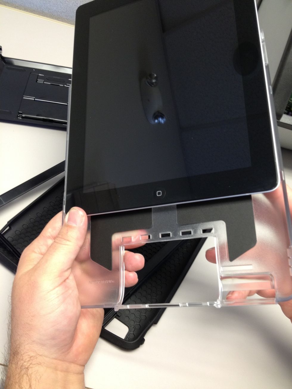 Luckily we have plenty of iPads laying around, I'm sure Jaydan won't mind us borrowing his. Slide the iPad into the plastic hold piece.