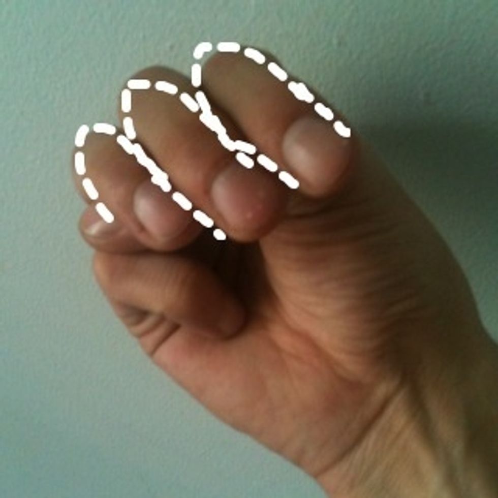 M: Tuck your thumb under 3 fingers. The three fingers represent the three humps on a cursive 