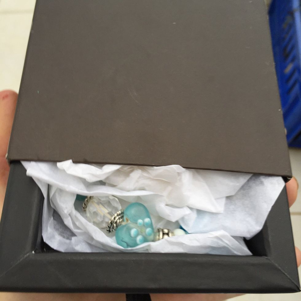 Made a pretty turquoise glass bead bracelet and found an old gift box I had saved. Wrapped bracelet in tissue paper