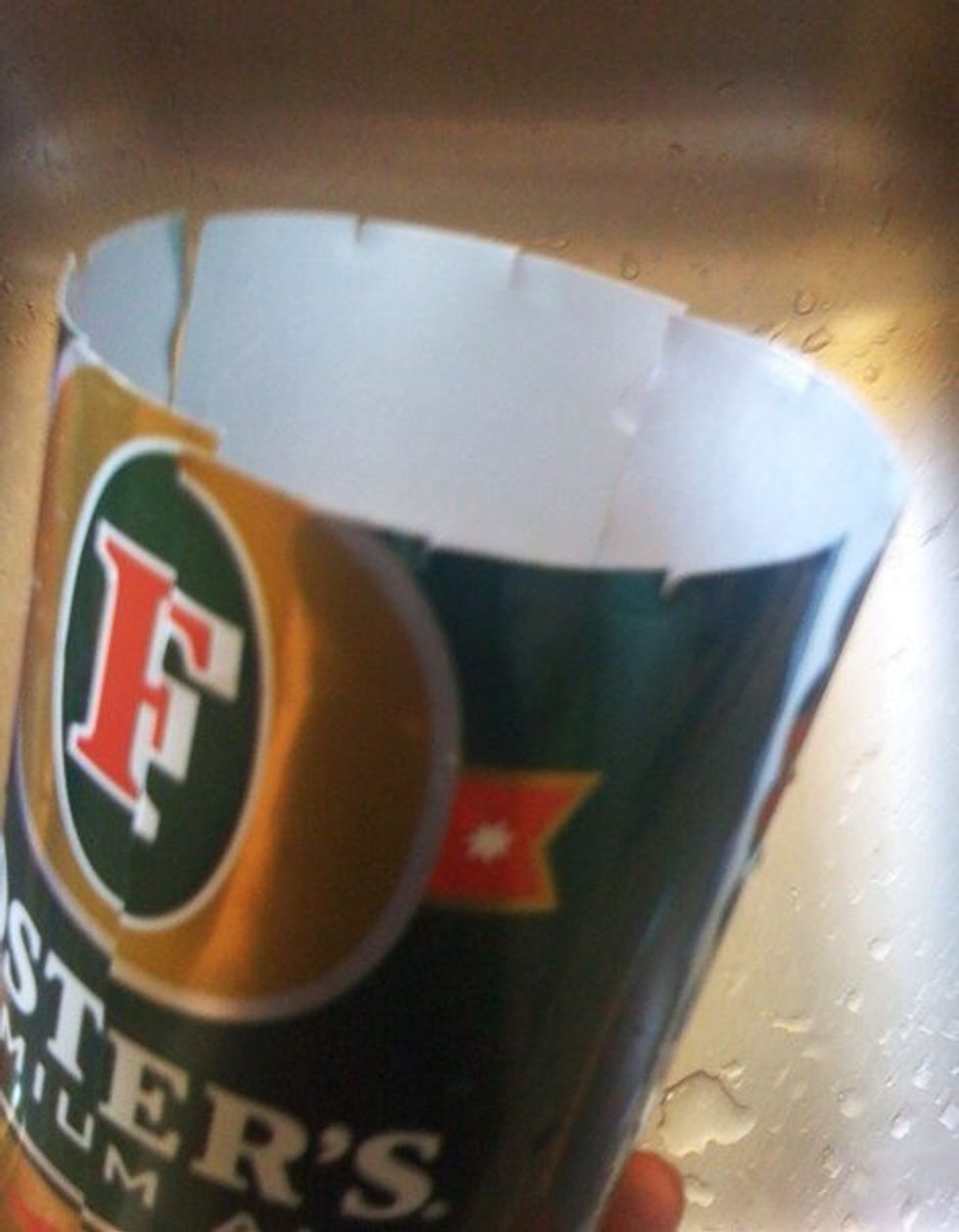 Make 12 evenly spaced slices down can. I use scissors. It helps to start w/ 4 in cross shape & then put 2 in between each (think clock). How far down to bottom u slice determines height of container.