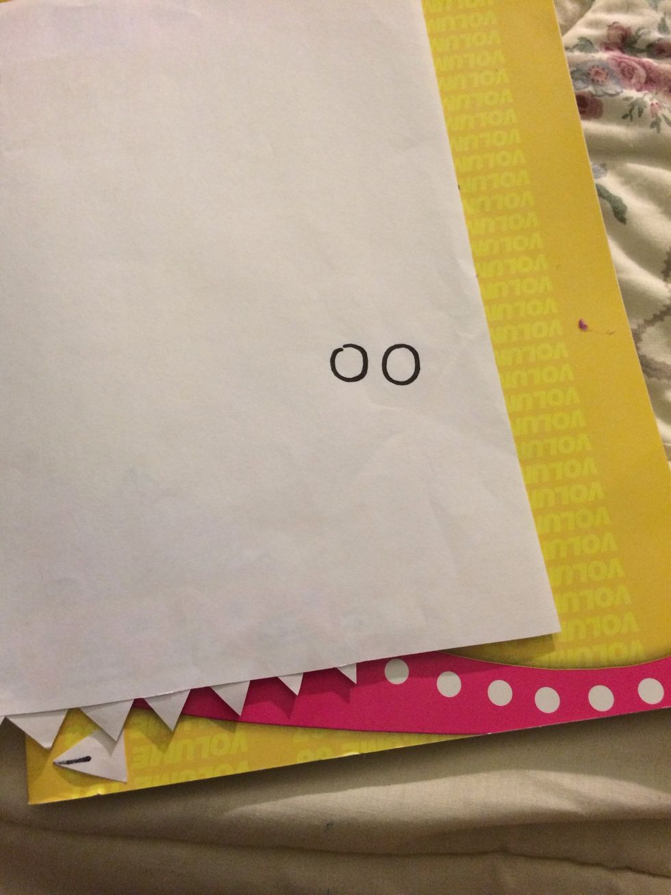 Make 2 circles for the eyes and decorate.