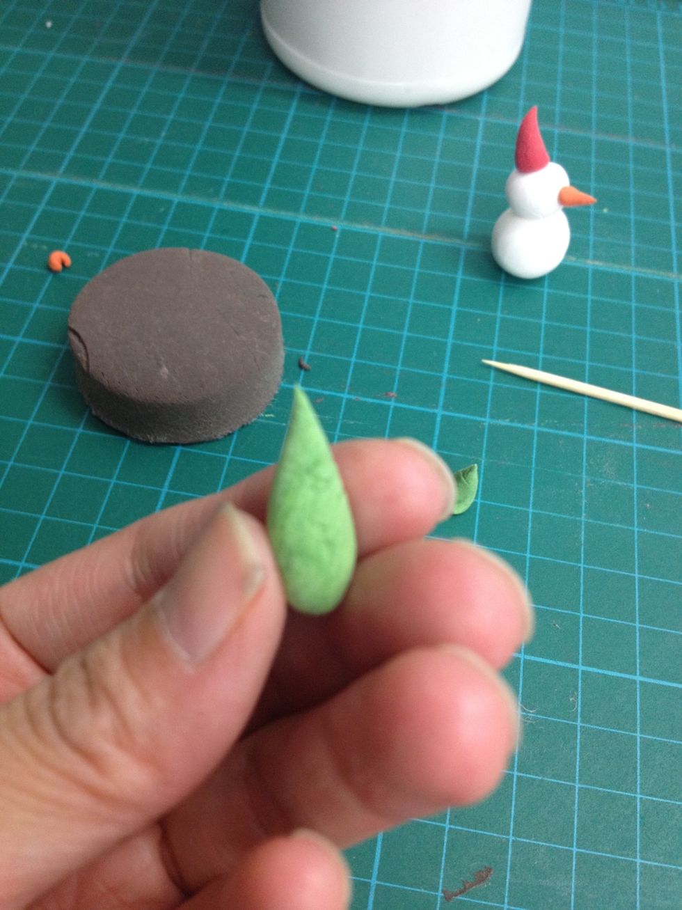 Make 2 green cones to become the trees.