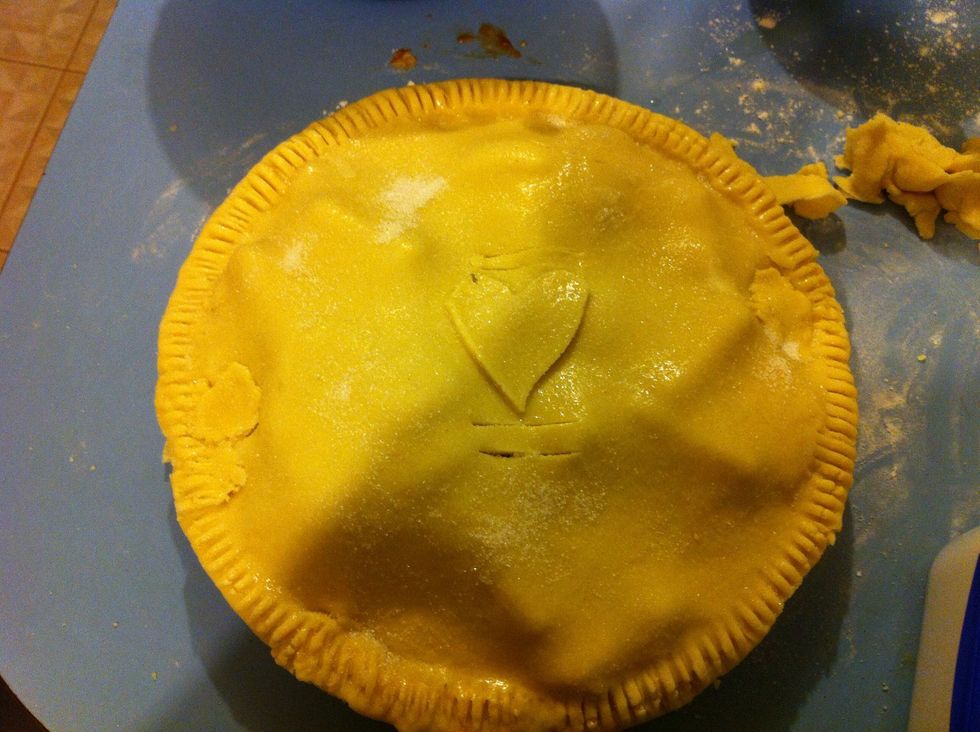 Make 3 or 4 slits in the pastry at the top for the steam to escape. Brush on remaining egg white all over pastry and sprinkle sugar over the top.