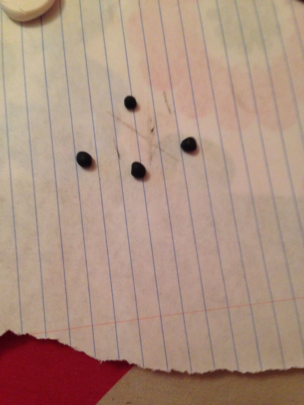Make 4 black balls for the ears