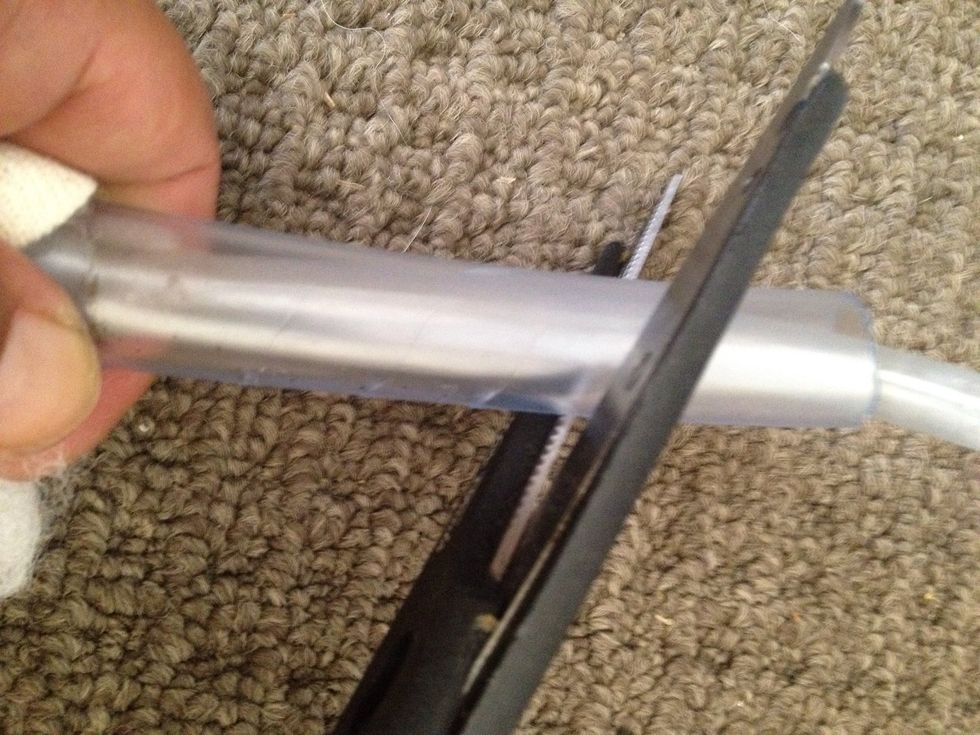 Make 4 small V's in the large tube (this lets the water out)