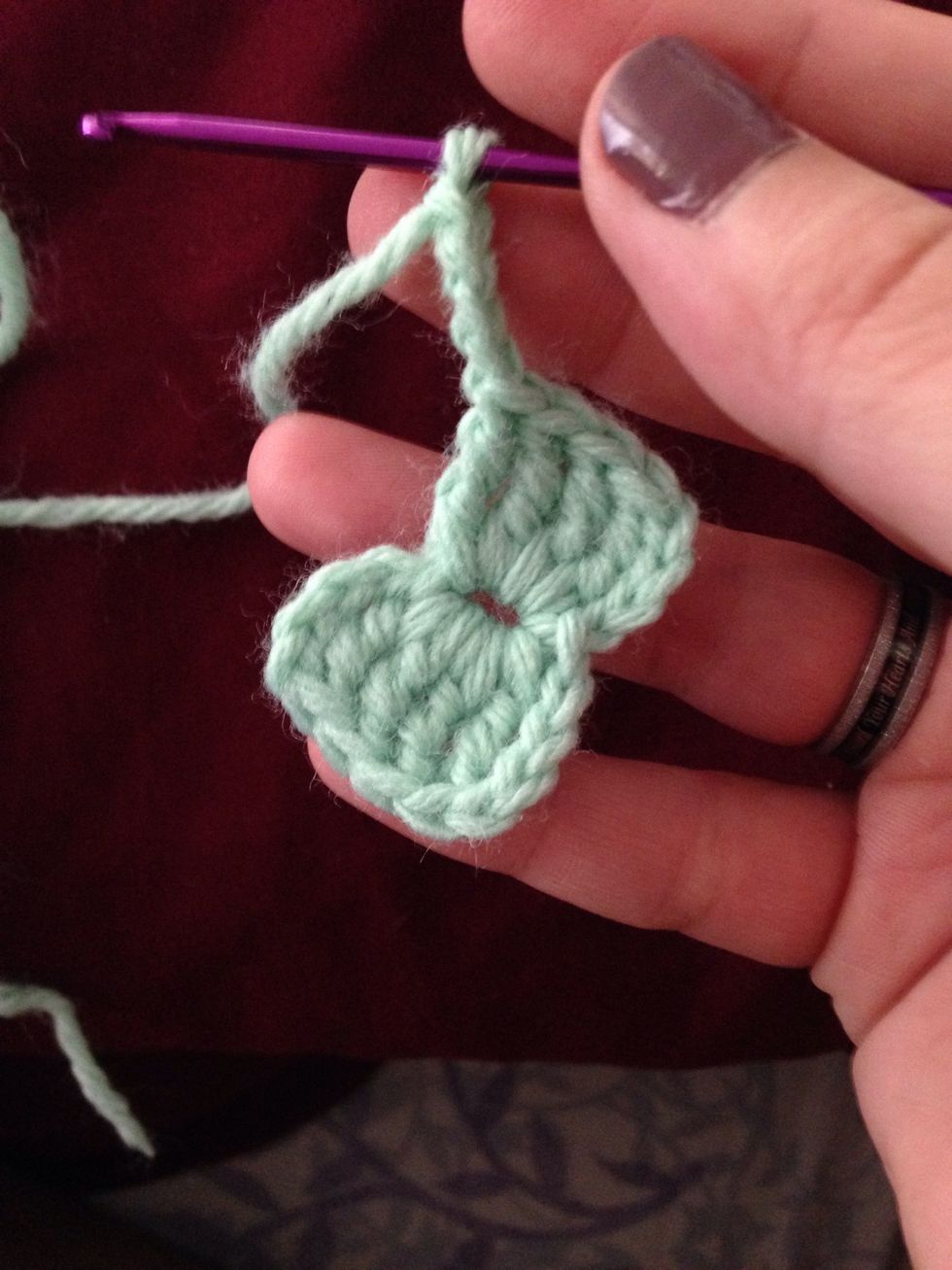 Make 4 treble crochets in center circle and ch 4.