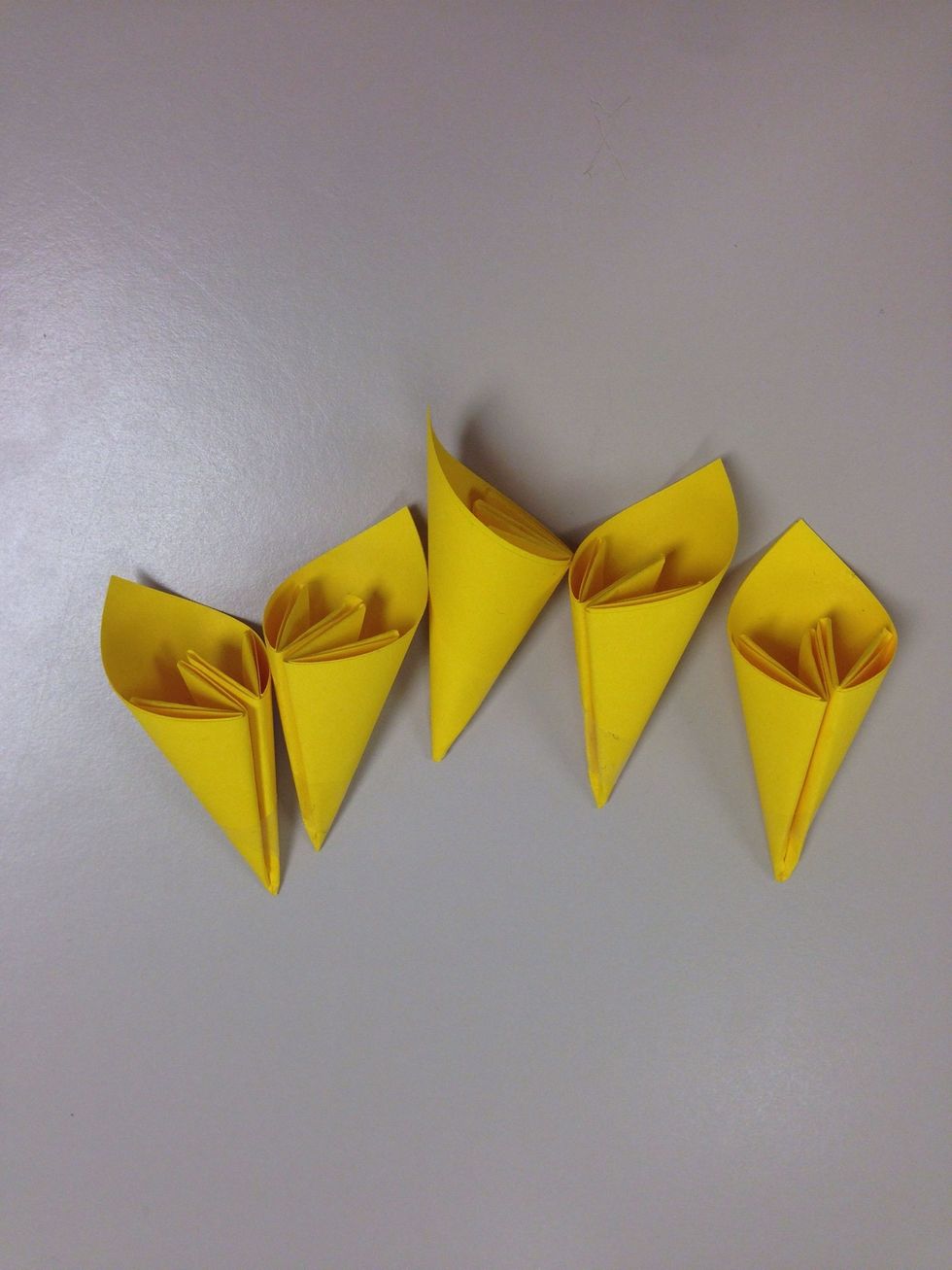 Make 5 " petals". You can also make 6 petal flowers