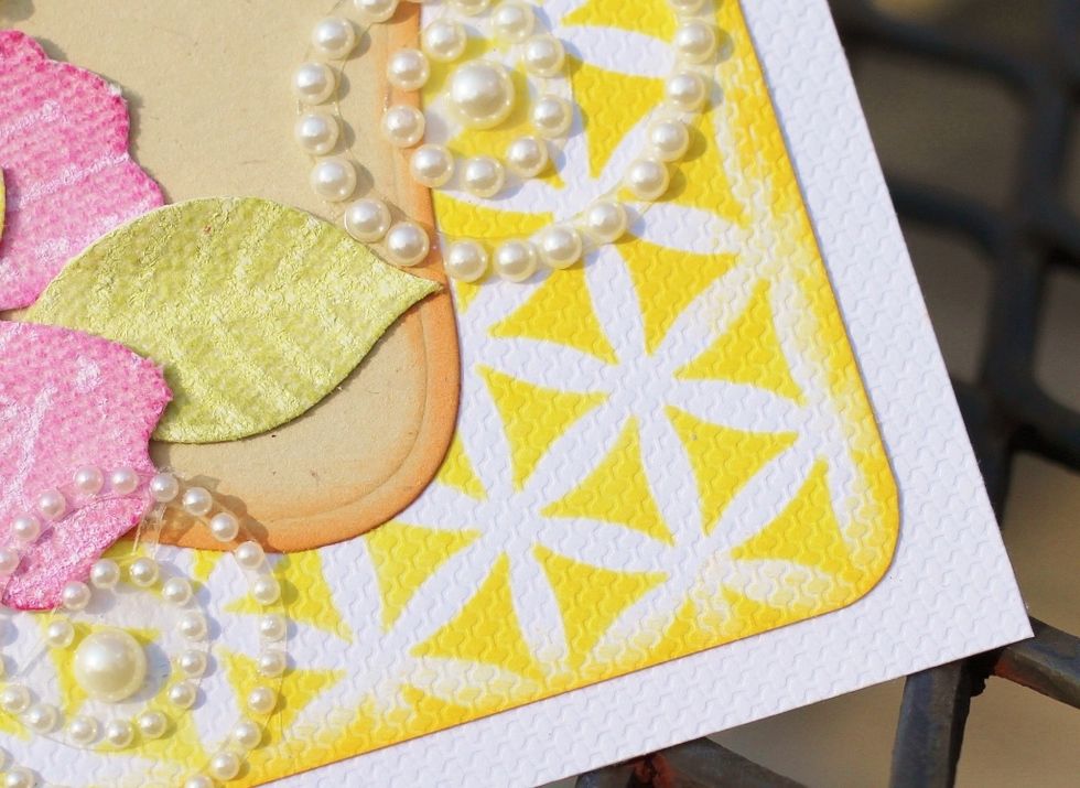 make 5 X 5 card base from white cardstock. stencil 4 1/2" X 4 1/2" piece of white cardstock with Canary and Marigold Pigment Inks applied using Stylus & Tips, round corners, distress edges and adhere.