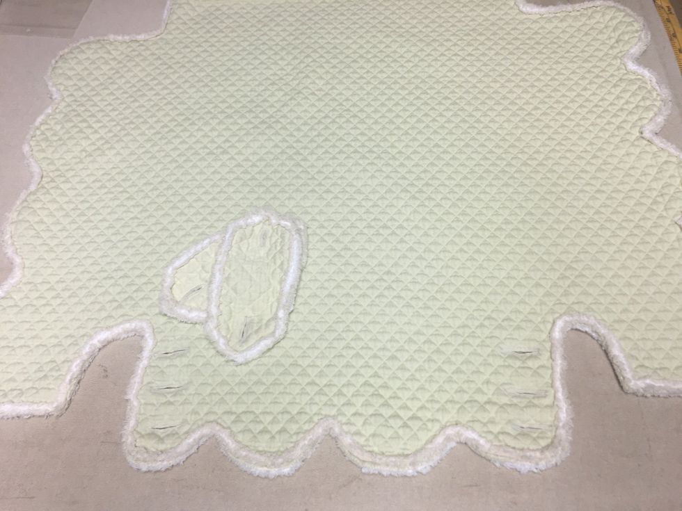 Make 6 buttonholes on the back flap.  3 on either side.  And 2 in each tab.