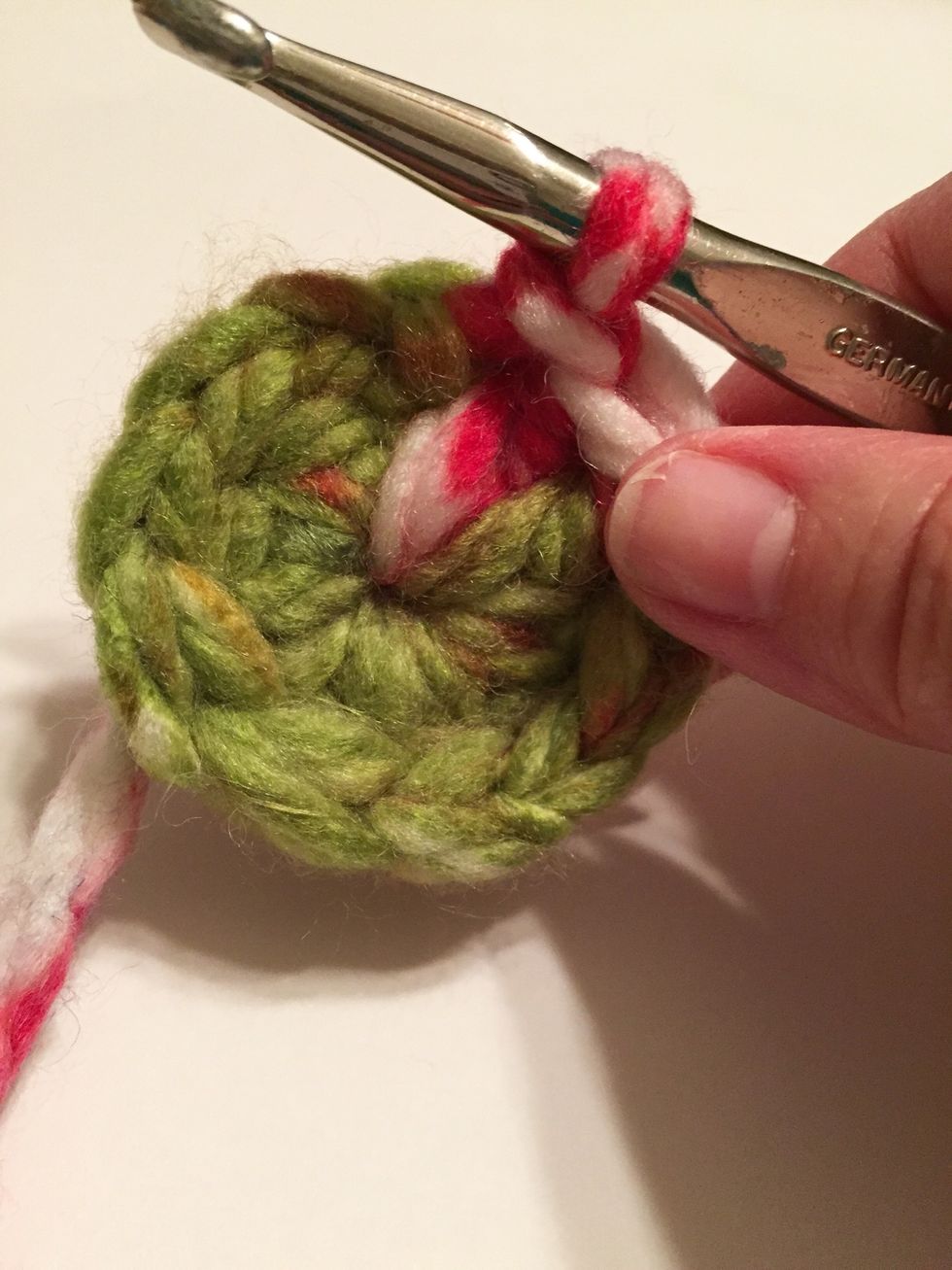 make 9 doubles in ring. slip stitch to connect.