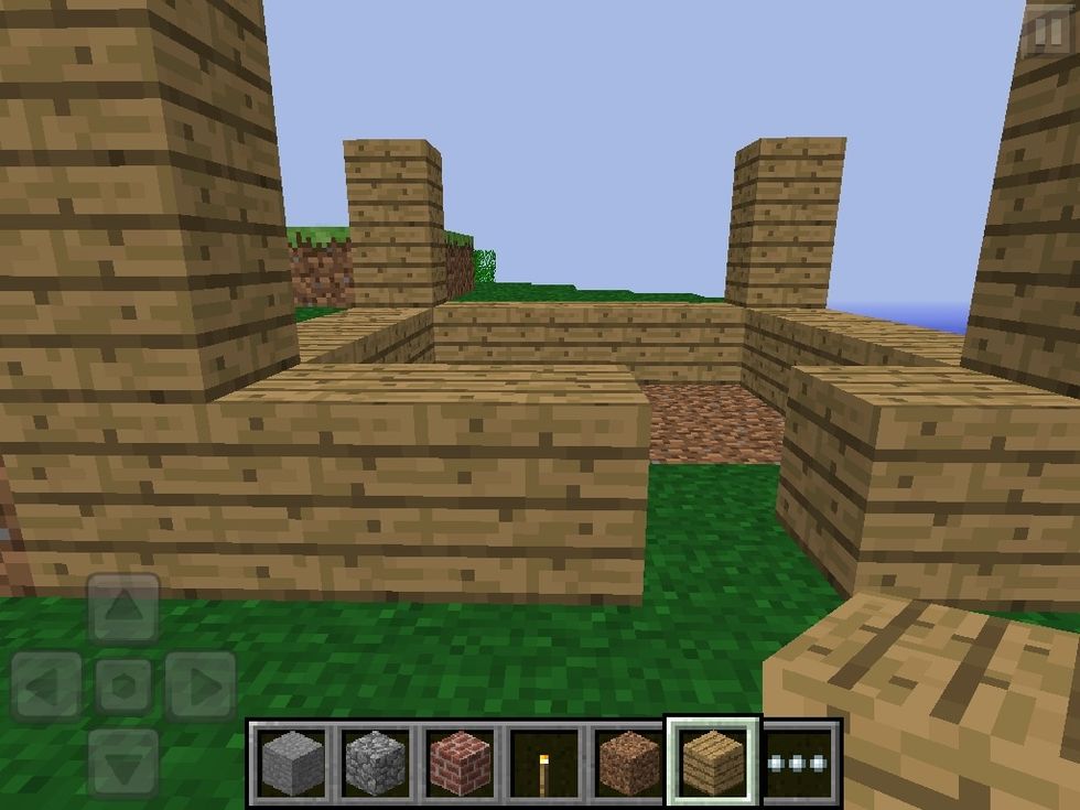 Make a 2 block high pillar on each of the corners