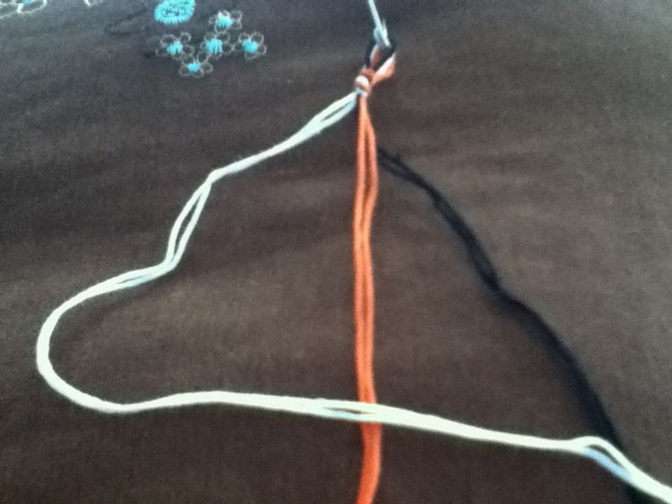 Make a "4" shape with your left thread.