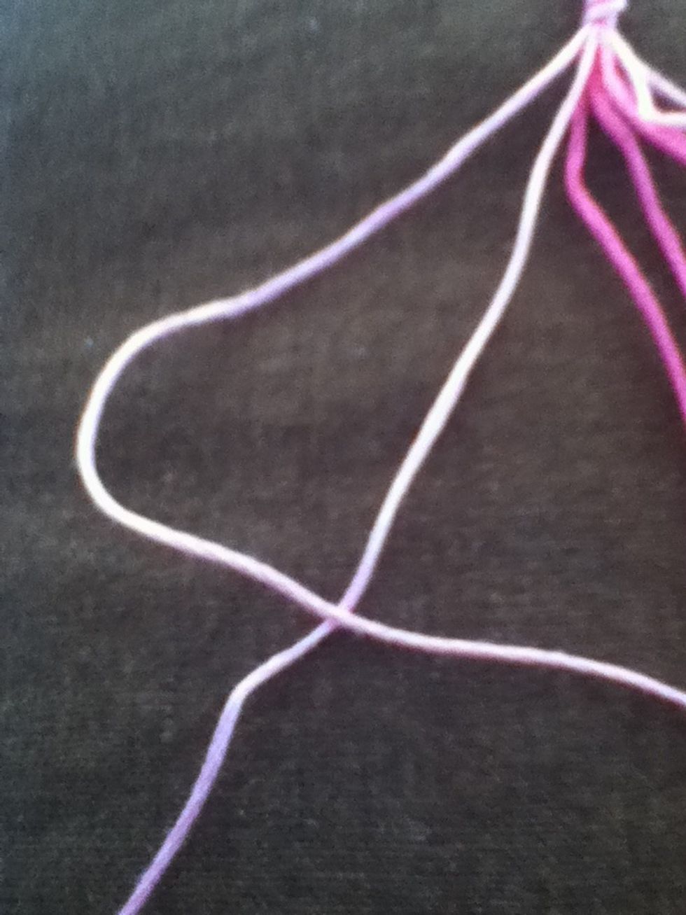Make a "4" with the two leftmost strands .