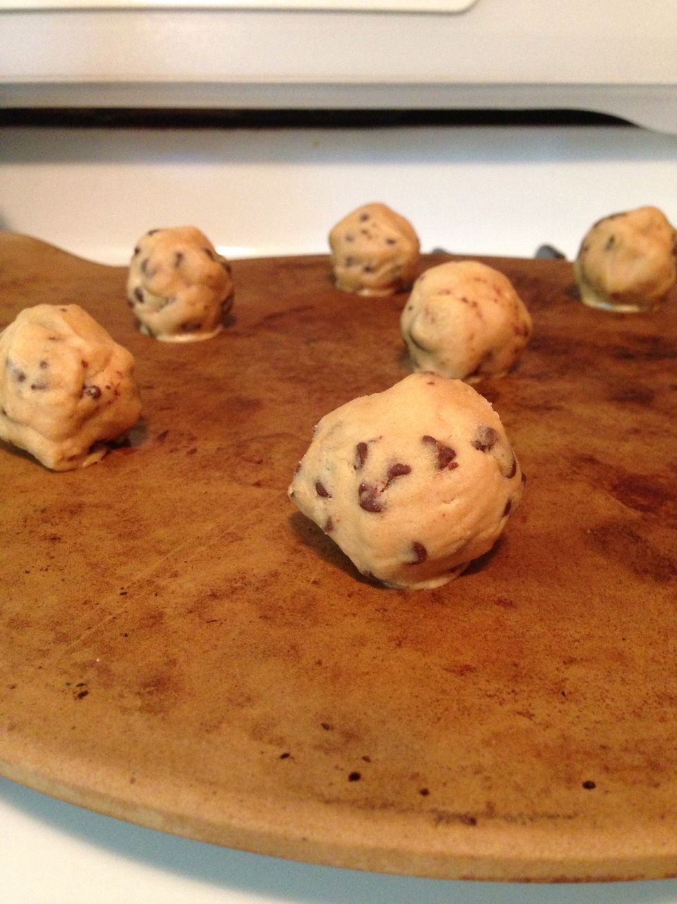 Make a ball a little smaller than the size of a golf ball & lay them out on your baking stone or cookie sheet. I prefer the stone because it cooks more evenly, just be sure to preheat it in your oven.