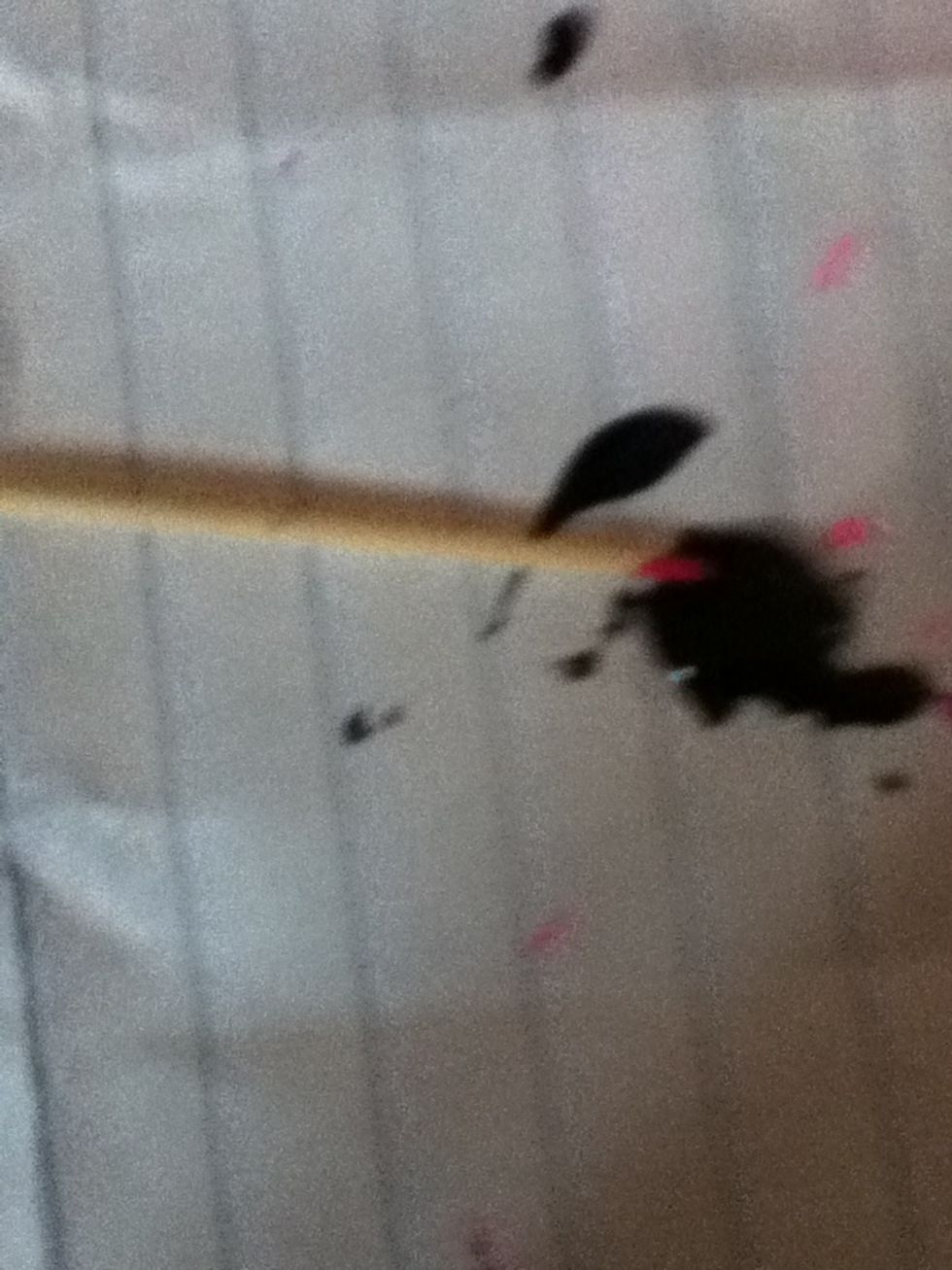 Make a blob of black nail polish in a piece of paper