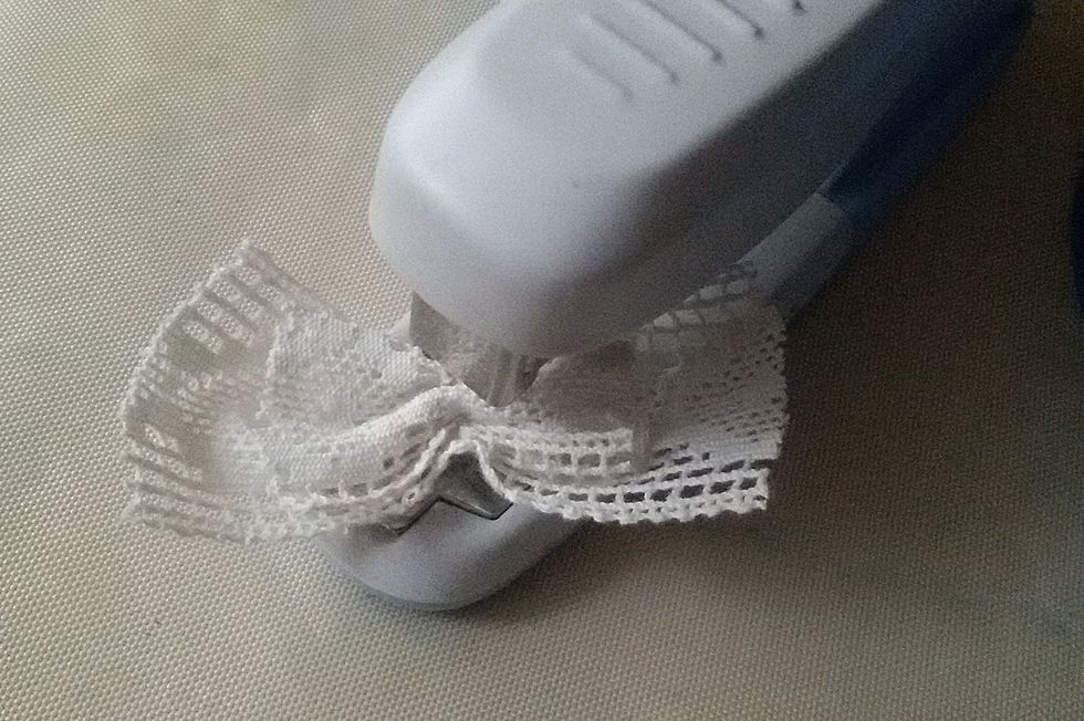 Make a bow of lace.