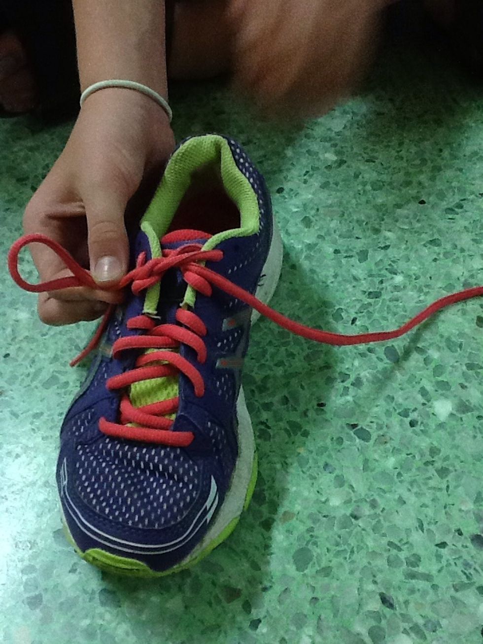 Make a bunny ear with one side of the lace