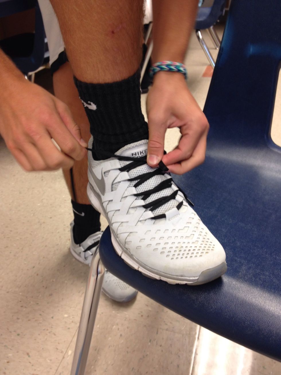 Make a bunny ear with the left lace.