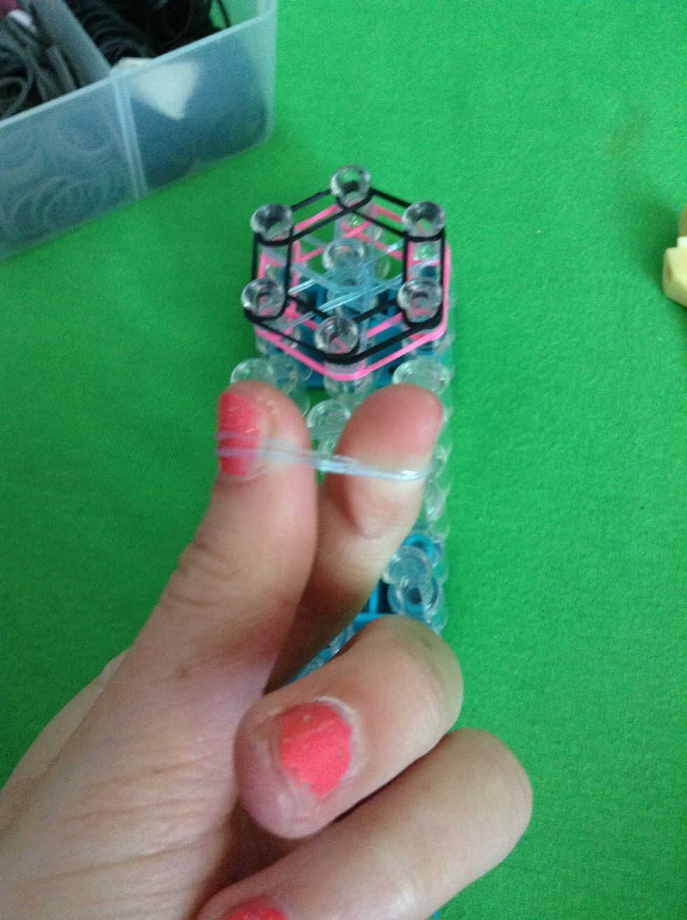 Make a cap band which is looping it around your finger twice