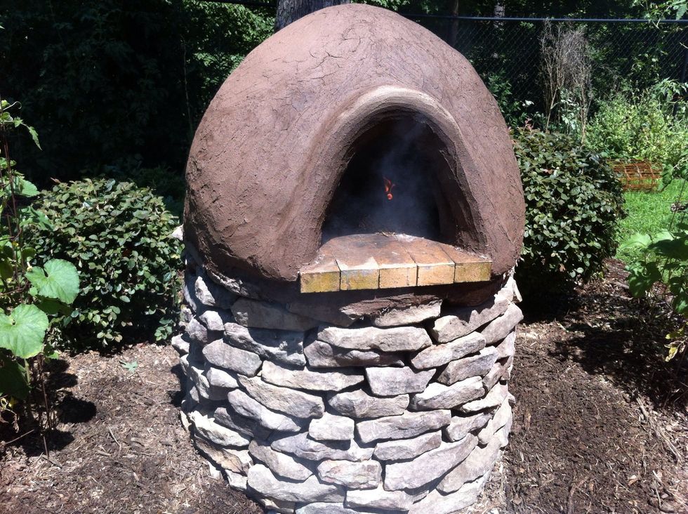 Make a cob oven and get a fire going inside. Let the fire burn for about 2 hours before you plan to cook to ensure oven is properly heated. Cob ovens use convection, conduction & radiation to heat.