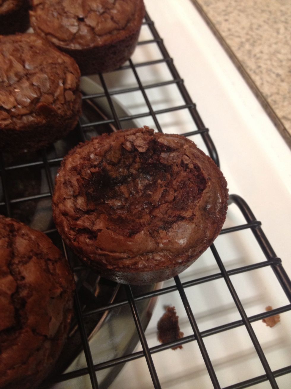Make a crater in each brownie. I use clean fingers or you can use a spoon or cool gadget