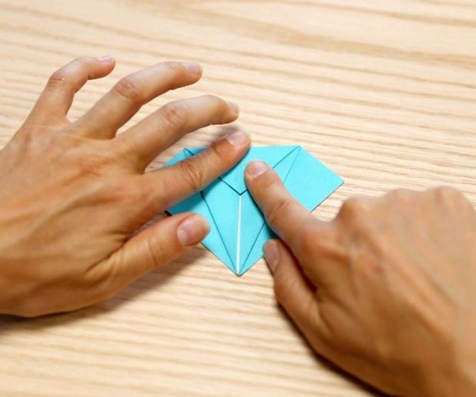 Make a crease on the top for the crane fold